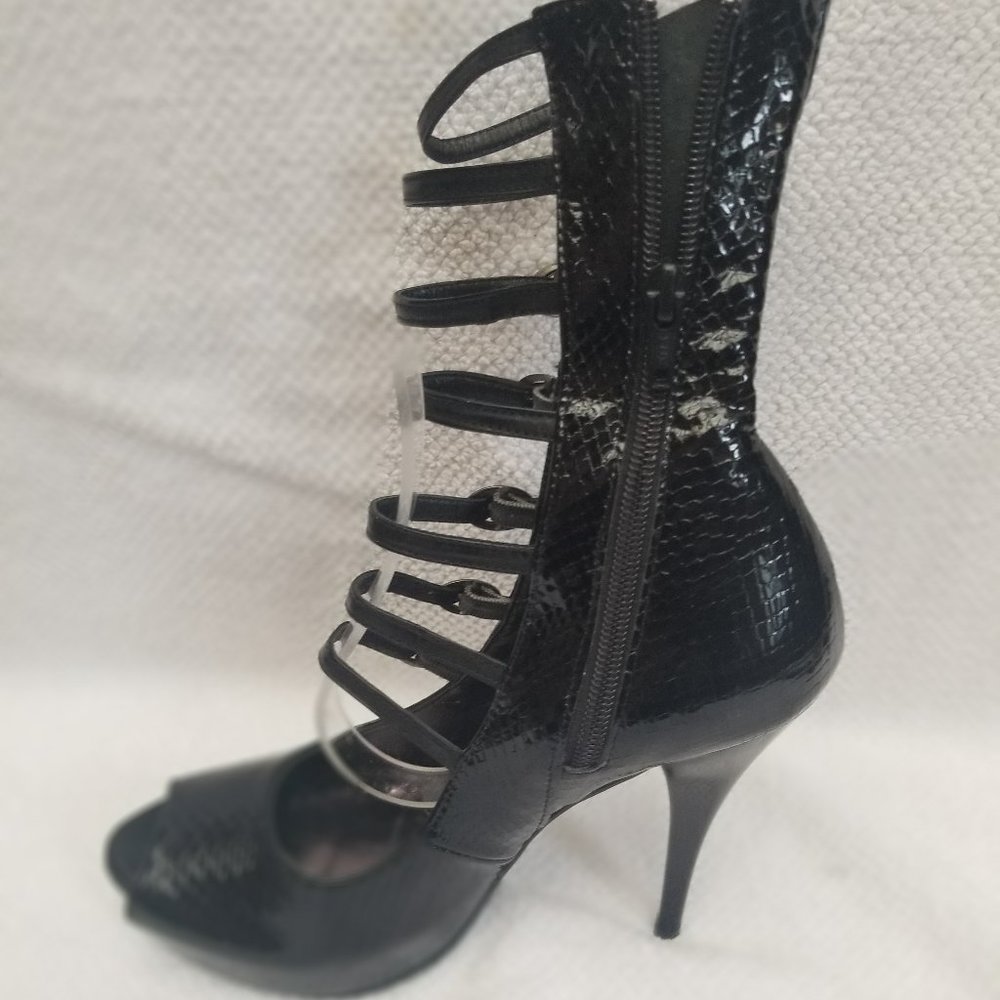 Strappy snakeskin design black heeled boots.